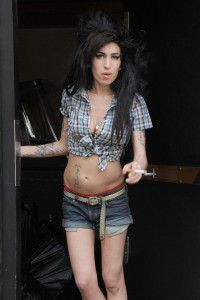 Amy Winehouse poses for the camera on the doorstep of her London home.<P><B>Ref: SPL28844 280408 </B