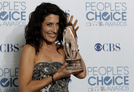 poses for a photo backstage at the People's Choice Awards on Wednesday, Jan. 5, 2011, in Los Angeles